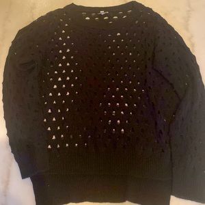Black sweater with 360 holes.